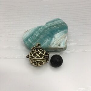 Pattern Aromatherapy Brass tone Locket.  Lava stone included.
